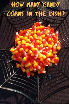 candy corn in the shape of a spider web with text overlay saying how many candy corn in the dish?