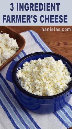 three blue dishes filled with cottage cheese on top of a wooden table next to a white and blue towel