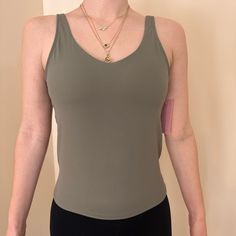 Brand New With Tags! Poshdivah Tank Top Is Crafted From A Buttery Soft Blend Of 80% Nylon And 20% Spandex, Ensuring Breathability, Elasticity, And Moisture-Wicking Properties. Built In Shelf Bra. Yoga Tops With Built-in Bra And Second-skin Fit, Green Seamless Top With 4-way Stretch, Green Seamless 4-way Stretch Top, Green Elastane Tops For Yoga, Green 4-way Stretch Elastane Tops, Green Elastane Yoga Tops, Elastane Tops For Pilates, Green Compressive Sleeveless Top, Compressive Green Sleeveless Top