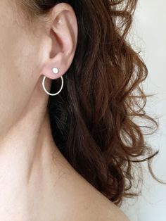 A set of ear jackets to mix and match. You can wear these as ear jackets, both back and front, or you can just wear the different studs. You will get 3 pairs of studs a dot, an open circle and a bar stud (each with a separate pair or ear backs) and one pair of open circle backs. Put on the stud, thread the circle back part through behind the earlobe, and close with the stopper behind. It might be tricky the first time but it is easy in front of a mirror. Mix and match these jackets for any occas Minimalist Pierced Open Circle Earrings, Minimalist Sterling Silver Round Ear Climbers, Sterling Silver Everyday Open Circle Earrings, Minimalist Metal Open Circle Earrings, Open Circle Stud Earrings, Minimalist Sterling Silver Open Circle Earrings, Edgy Earrings, Bar Studs, Ear Jacket