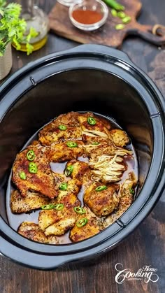 the food in the slow cooker is ready to be eaten and served on the table