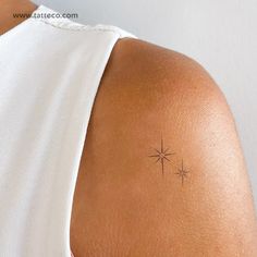 a woman with a small star tattoo on her back