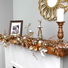 a fireplace mantel decorated with gold and silver ornaments