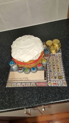 a cake sitting on top of a table next to coins