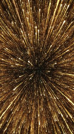 an abstract background with gold and white stars in the center, looking like a starburst