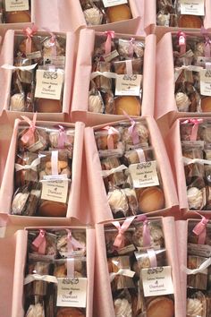 many boxes filled with different types of pastries