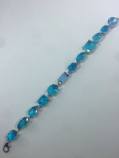 This Blue Topaz and Blue Quartz bracelet is very lively and bright. The stones are deep colors and different tones of blue The sterling silver is plated with rhodium to protect the bracelet from tarnish and give the appearance of white gold. 8 inches All jewelry is shipped in a nice gift box. Check out our over a THOUSAND great reviews Engraving is $4 per letter and is not always perfect depending on the piece. It can take a few days if the jeweler is busy. This is payable to Paypal Judithsltd@g Modern Blue Multi-stone Jewelry, Luxury Blue Bracelets With Gemstone Accents, Formal Blue Bracelets With Gemstone Accents, Elegant Blue Multi-stone Bracelets, Elegant Blue Multi-stone Bracelet, Formal Blue Topaz Blue Bracelets, Formal Blue Topaz Bracelets, Luxury Blue Gemstone Sterling Silver Bracelet, Blue Bracelet With Gemstone Accents As Gift