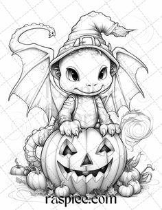 a cute little dragon sitting on top of a pumpkin