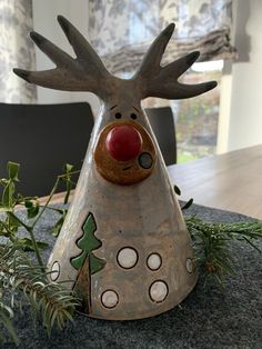 a christmas decoration with a reindeer head on the table