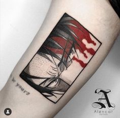 a woman's arm with a red and black tattoo design on the left forearm