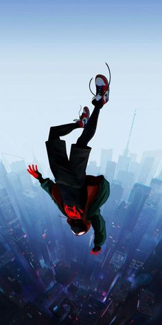 a man flying through the air on top of a spider - man suit in front of a cityscape