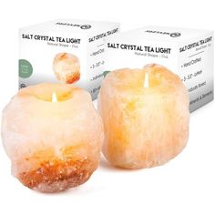 two candles sitting next to each other on top of a white box with the words salt crystal tealight