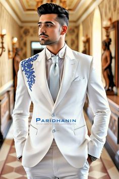 =>UNIQUE CREATION - PLEASE RESPECT COPYRIGHT<= All images and content on this site are exclusively crafted and owned by Paridhanin. Unauthorized copying, sharing, or reproduction is prohibited and will be subject to legal action. This stunning white suit with elegant blue embroidery on the shoulder is crafted from high-quality fabric, offering a sophisticated and modern look. Ideal for grooms who wish to stand out, this suit combines contemporary style with traditional elegance, perfect for making a statement on your wedding day. The price includes Jacket and pant only. Other accessories if you want like shirt , tie and pocket square will be available on extra cost. For this message us in personalisation box. The suit is meticulously crafted from a luxurious  polyester blended fabric, ensu Fancy White Suit Men, Groom Suit White, Wedding Suit For Groom, Outfit For Groom, Suit For Groom, Groom Party, Embroidery Modern, Cream Suit, Modern Groom