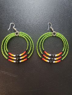 Beaded Hoop Earrings.  #10 Czech beads.  2" in diameter. Adjustable Beaded Dangle Hoop Earrings, Adjustable Hoop Beaded Earrings With Colorful Beads, Adjustable Hoop Earrings With Dangling Beads, Adjustable Hoop Beaded Earrings With Dangling Beads, Adjustable Colorful Beaded Round Earrings, Green Hoop Earrings With Ear Wire, Adjustable Colorful Beaded Circle Hoop Earrings, Adjustable Beaded Hoop Earrings, Green Beaded Dangle Hoop Earrings