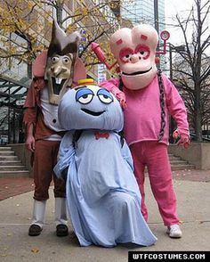 three people in costume standing next to each other