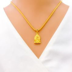 This attractive pendant, exquisitely crafted from 22k gold and weighing 3.2 grams, features a finely engraved depiction of Sai Baba set against a luminous yellow gold finish. The pendant has a length of 0.9 inches, making it both noticeable and modest in size, ideal for daily wear. Perfect for devotees who wish to keep Sai Baba close to their hearts, this pendant combines spiritual devotion with elegant craftsmanship, offering a timeless piece that embodies grace and serenity. PRODUCT DETAILS Gold Purity(karat): 22k Gold Weight(grams): 3.2 Item Finish: Yellow Gold Pendant Length: 0.9" Chain: Not Included Gold Engraved Temple Necklace For Rituals, Spiritual Yellow Gold Pendant Temple Necklace, 22k Yellow Gold Spiritual Temple Necklace, Saibaba Pendant Gold, 22k Gold Spiritual Round Pendant, Bridal Jewelry Necklace, Precious Stones Rings, Diamond Pendant Sets, Jhumki Earrings