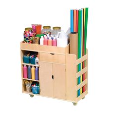 a wooden cart filled with lots of craft supplies