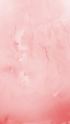 an orange and pink watercolor background with white paint