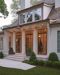 the instagram page shows an image of a house with large windows and steps leading up to it