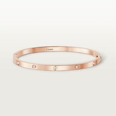 Cartier - Love bracelet, small model, 10 diamonds - Bracelet Woman Pink gold/Diamond - Love bracelet, small model, 18K rose gold, set with 10 brilliant-cut diamonds totaling 0.21 carat. Sold with a screwdriver. Width: 3.65 mm. Cartier Love Bracelet Diamond, Bracelets Design, Bracelet Love, Love Bracelet, Girl Jewelry, Cartier Love, Bracelet Collection, Cartier Love Bracelet, Love Bracelets