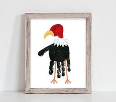 a painting of a hand with a bird on it's head is shown in front of a white wall