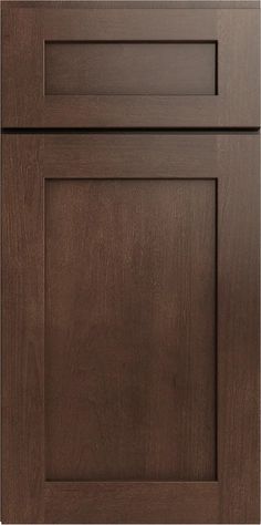 a close up view of the front and side panels of a kitchen cabinet door with dark wood grained finish