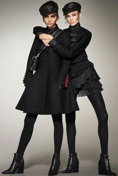 two women in black clothes are posing for a magazine page with the caption campaign