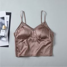 2024 NEW IN! Women Silk Camisole Bra. You can wear it as a camisole, or as a inner. Made of 6A grade mulberry silk, sewn with delicate lace.The garment is lightweight, breathable, healthy, comfortable, just like your second skin.Material: - Main part: 93% mulberry silk, 7% spandex, stylish and Comfortable! - Cup lining: 100% mulberry silk.- Lace: 85% chinlon, 15% spandex, make it more elegant and sexy!-----FEATURES------- Comfortable and stylish Seamless camisole bras.- Adjustable Straps to ensu Elegant Camisole Top With Removable Bra Pads, Elegant Camisole Bra For Spring, Elegant Spaghetti Straps Bra For Spring, Elegant Summer Camisole With Removable Bra Pads, Camisole With Removable Bra Pads, Solid Camisole With Removable Bra Pads, Summer Camisole Bra, Silk Bra, Camisole Bra