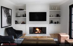 a living room filled with furniture and a flat screen tv mounted above a fire place