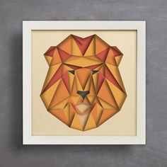 an animal's head made out of geometric shapes on a white framed paper frame