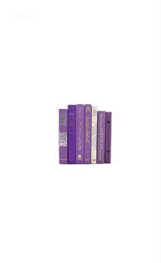 a row of purple books sitting on top of each other