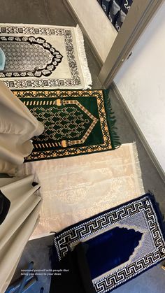 several different rugs are on the floor next to each other