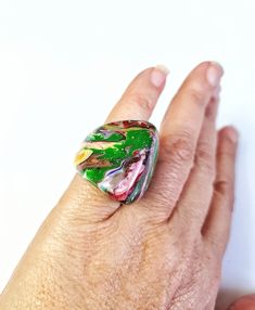 This ring is part of the Pollock line and is called Gotejado. This is the multicolor version which features a marbled motif in an array of colors. This is a size 6.75. I also have the necklaces, bracelets and earrings in this pattern. The first United Nations Conference to address environmental degradation was held in Stockholm in 1972. Already at that time the designer Carlos Sobral was working with resin and creating new techniques and alternative products to reuse all the raw material he cons Environmental Degradation, Places In New York, Earring Cards, United Nations, Raw Material, Fabric Jewelry, Jewelry Pouch, Global Fashion, Statement Ring