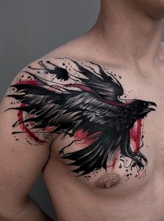 a man's chest with a black and red tattoo design on his left side