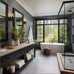 a bathroom with a tub, sink and large windows