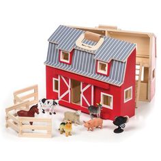 a toy barn with farm animals in it