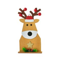 a wooden reindeer with a red hat and star on it's antlers is standing in front of a white background