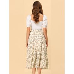 It is a perfect piece to pair with a crop top or basic tee and sneakers for a stunning day look or styled with sandals to go out! Versatile floral skirt for daily casual style, or eye-catching piece as a chiffon skirt. This long chiffon skirt creates an effortlessly elegant silhouette with its cinched waist and tiered hem. This A-line skirt features a dainty floral print, ruffle ruched, tiered design, and in a perfect ankle length. Cut from chiffon fabric and soft lining with a flowy silhouette Spring Tiered Skirt With Ditsy Floral Print, Flowy Tiered Floral Print Skirt, Feminine Tiered Floral Print Skirt, Beige Floral Print Tiered Skirt, Brown Floral Ruffle Tier Midi Skirt, Picnic Skirt, Long Chiffon Skirt, Long Floral Skirt, Ruffle Maxi Skirt