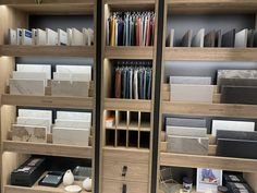 the shelves are filled with different types of tile and flooring materials in this store