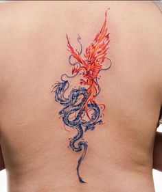 a woman's back with a dragon tattoo on it