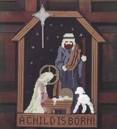 a cross stitch nativity scene with the birth of jesus