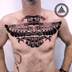 a man with an eagle tattoo on his chest