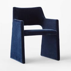 a blue chair sitting on top of a white floor