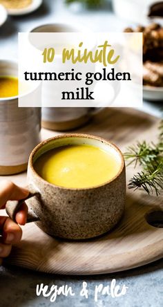 a close up of a cup of food on a plate with the words 10 minute turment golden milk