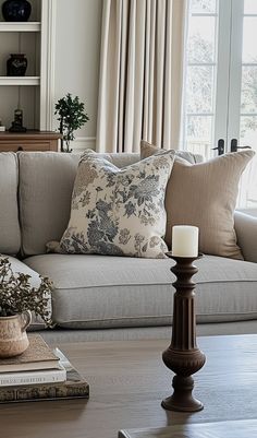 a living room filled with furniture and pillows