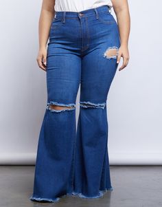 The '70s are coming back and we are fully here for it. Channel your inner groovy baby in the Curve Far Out Jeans. These jeans feature a stretchy blue denim material, a high rise waist, frayed flare bottoms, two ripped knee details and one rip detail on the side. We love to see these jeans paired with platform sandals and a rock n roll tee to complete that gorgeous groovy vibe. Model is 5'8.5", bust 40" D, waist 32.5", hips 45.5", and is wearing a size 1XL. Materials and Care These jeans are made 70s Summer Fashion Plus Size, 70s Inspired Outfits Plus Size, 70s Girl, 70s Bohemian, Flare Bottoms, Super Flare Jeans, Plus Size Looks, Flair Jeans, 70s Inspired Fashion