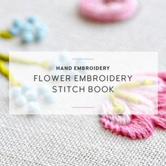 the embroidery flower embroidery stitch book is open and has pink, blue, yellow and white flowers on it