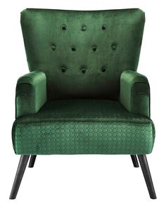 a green velvet chair with black legs