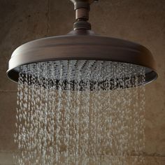 a shower head with water flowing from it