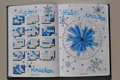 an open notebook with snowflakes on it and the word's written in blue